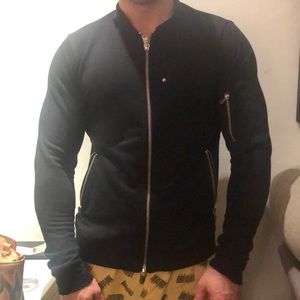 Black zip up jacket. Made in Portugal